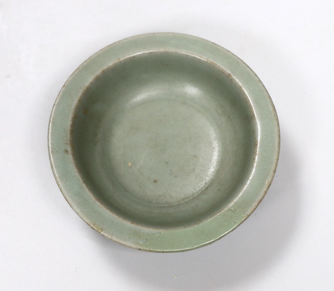 A Chinese Longquan celadon dish, Song-Yuan dynasty, 12cm. Provenance - Dr H. Ginsburg collection